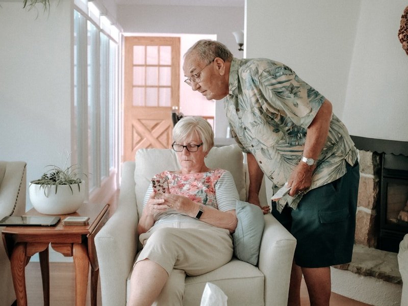 An older couple sitting peacefully in their warmly lit living room
